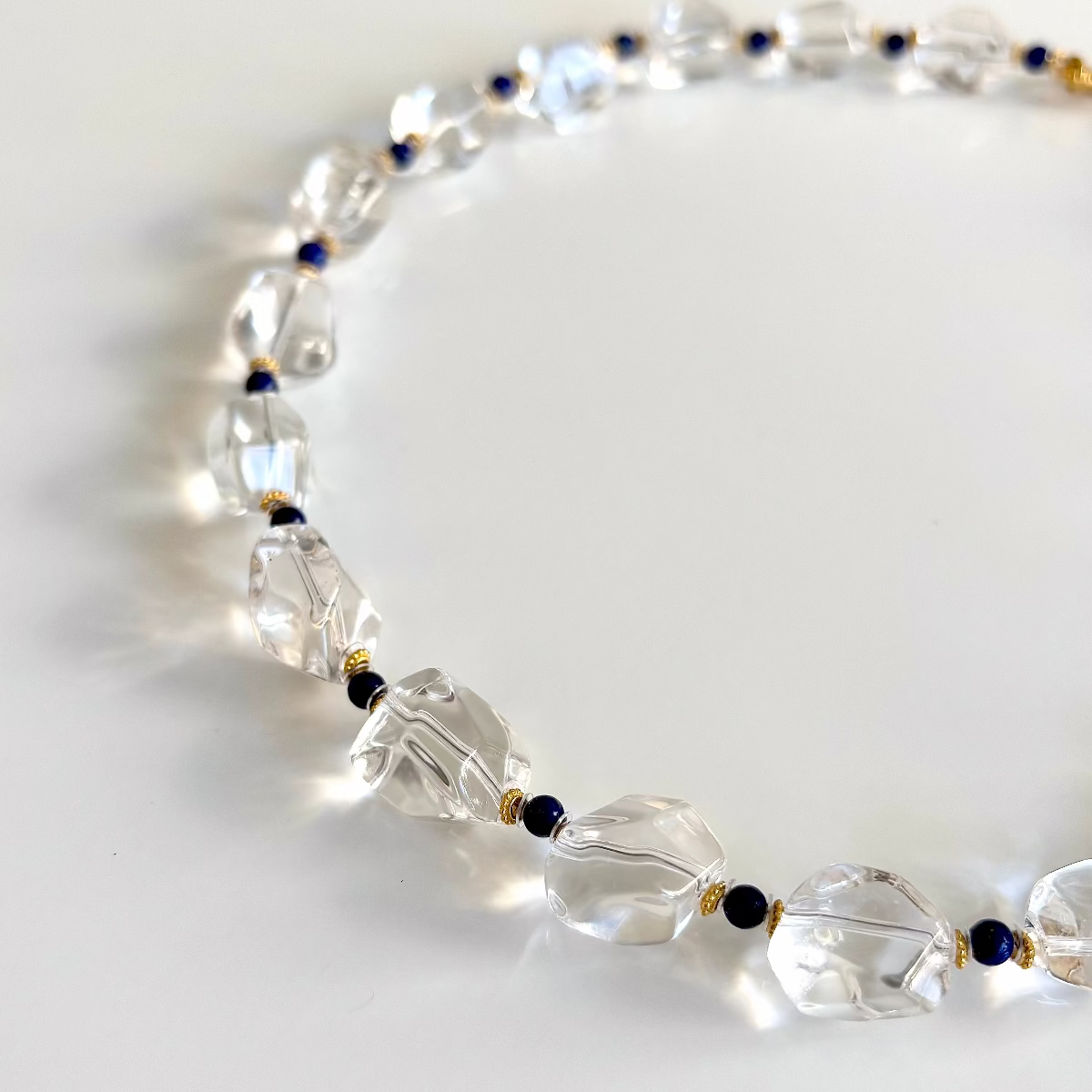Geometric white quartz necklace with navy lapis beads