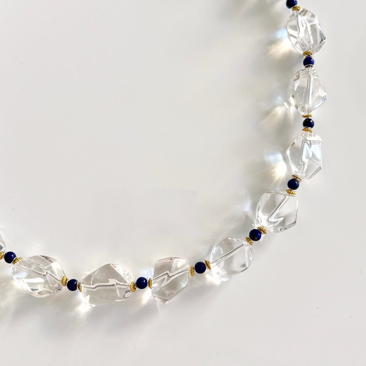 Geometric white quartz necklace with navy lapis beads