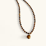 Close-up of tiger eye gemstone necklace with warm brown tones